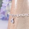 Handmade Sterling Silver large link curb chain bracelet with sterling silver ammonite charm to the centre