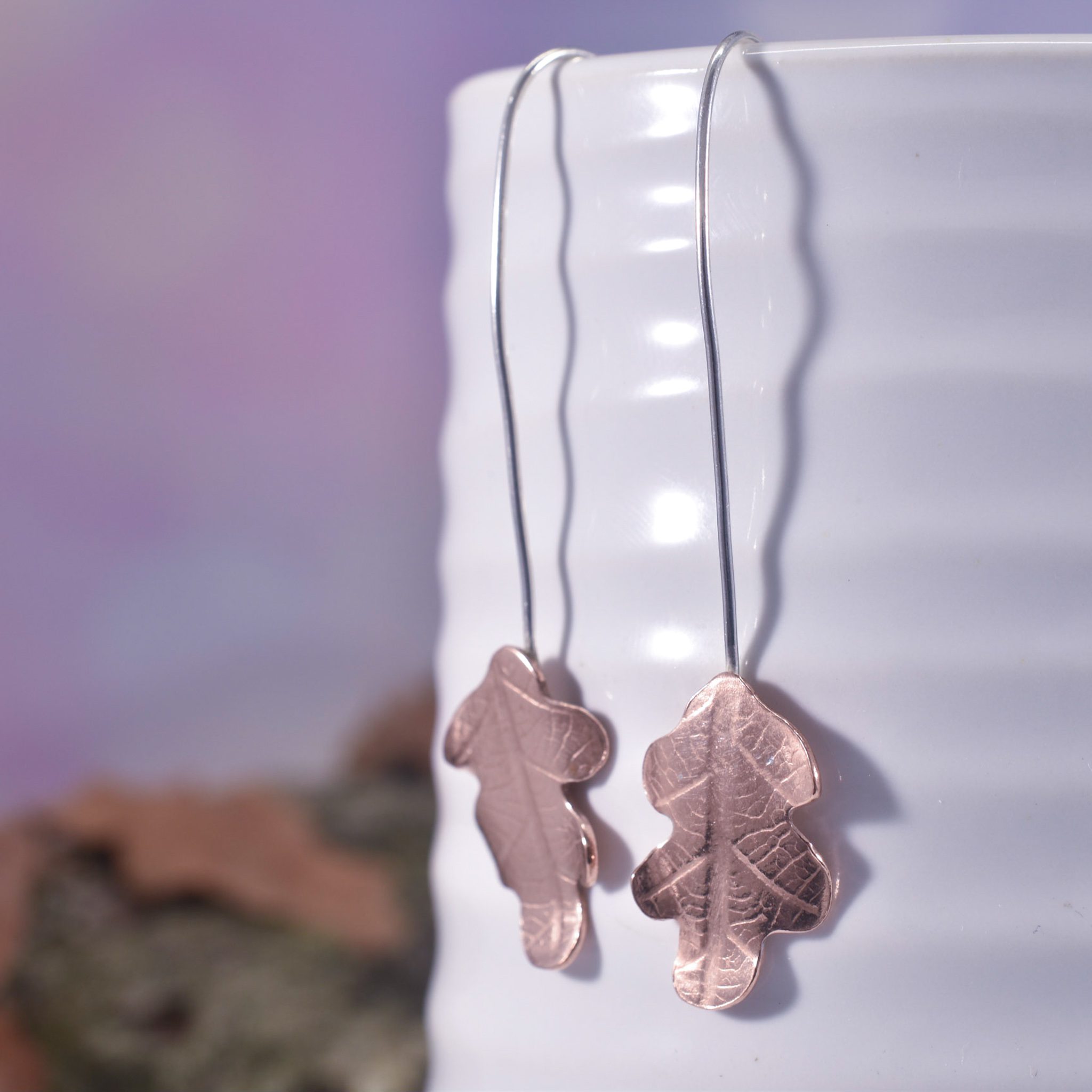 Sterling silver long drop earrings with copper oak leaves