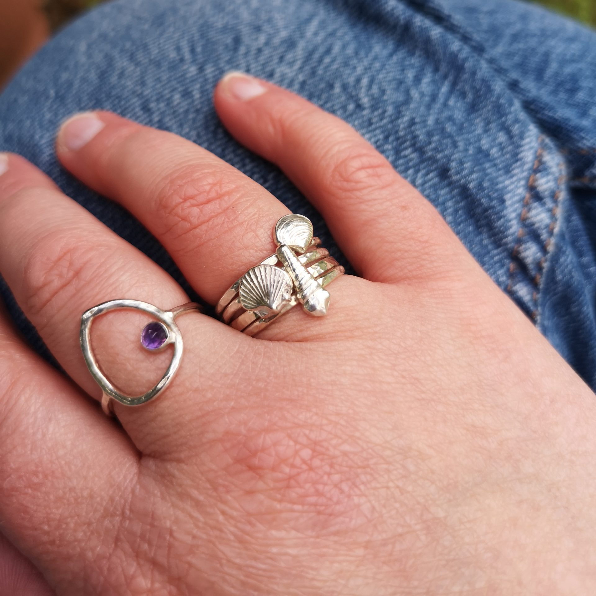 Sterling silver shell rings worn stacked
