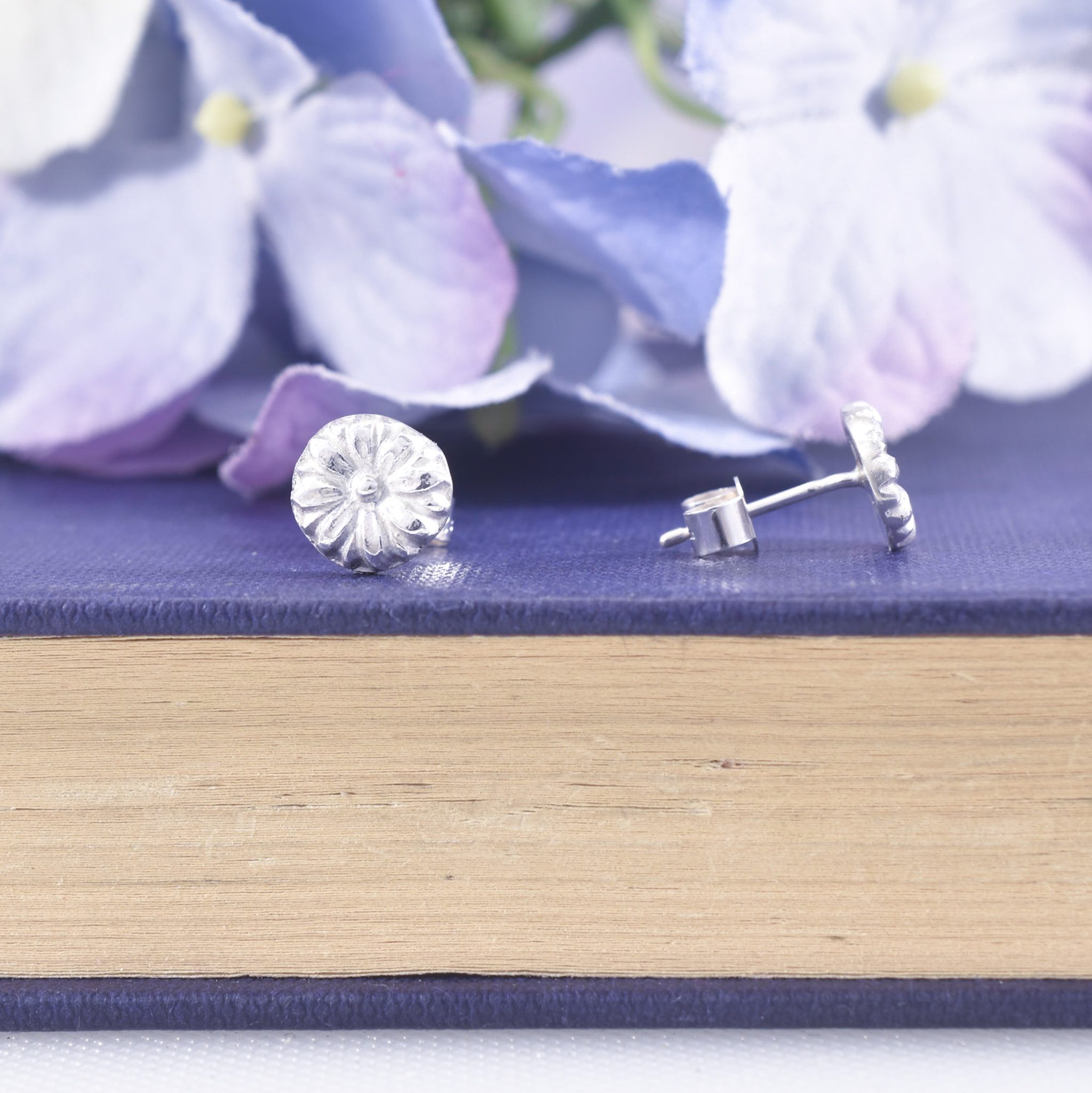 Sterling silver 3d stud earrings shown front and side on