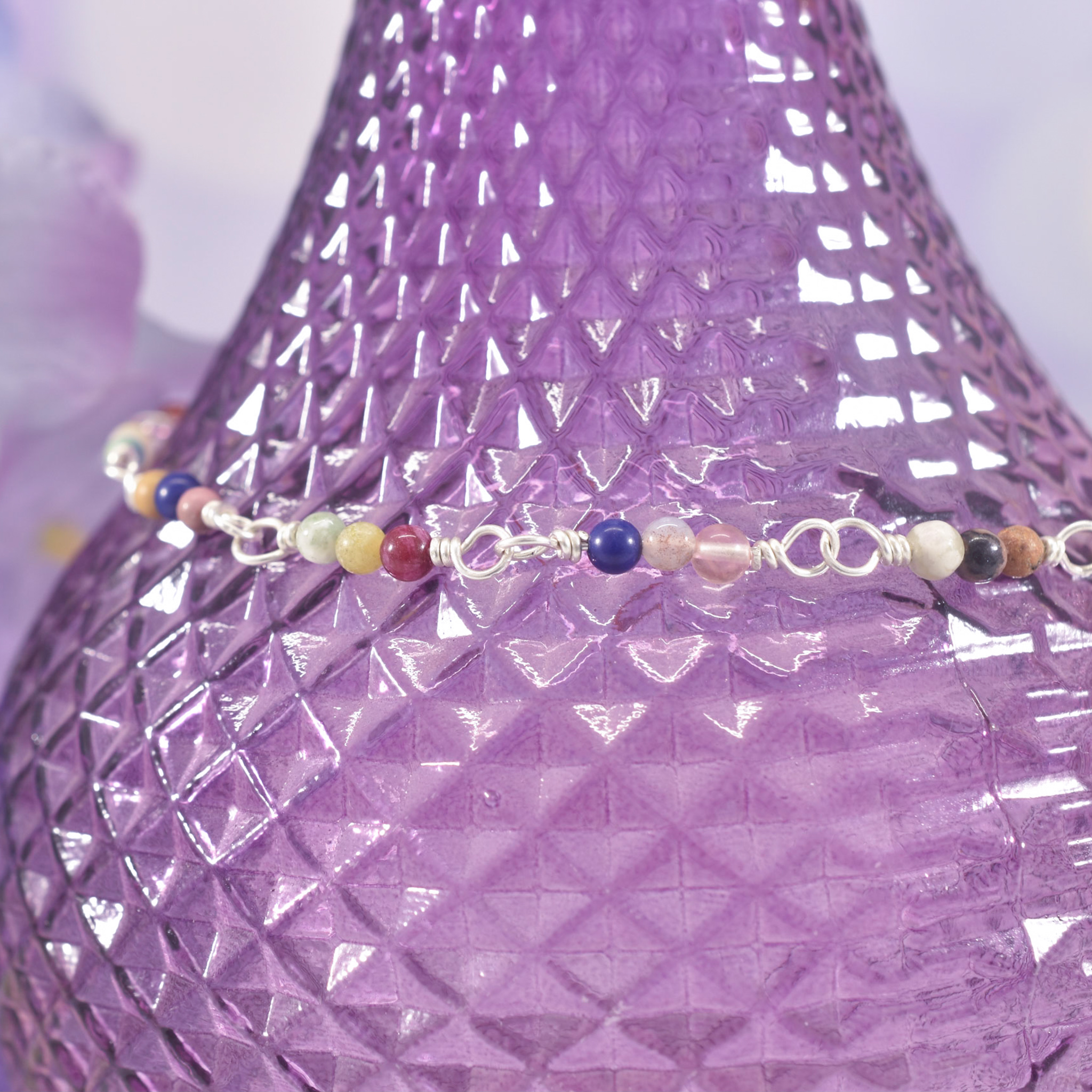 Multi coloured gemstone beads linked with silver wire create this beautiful Boho anklet
