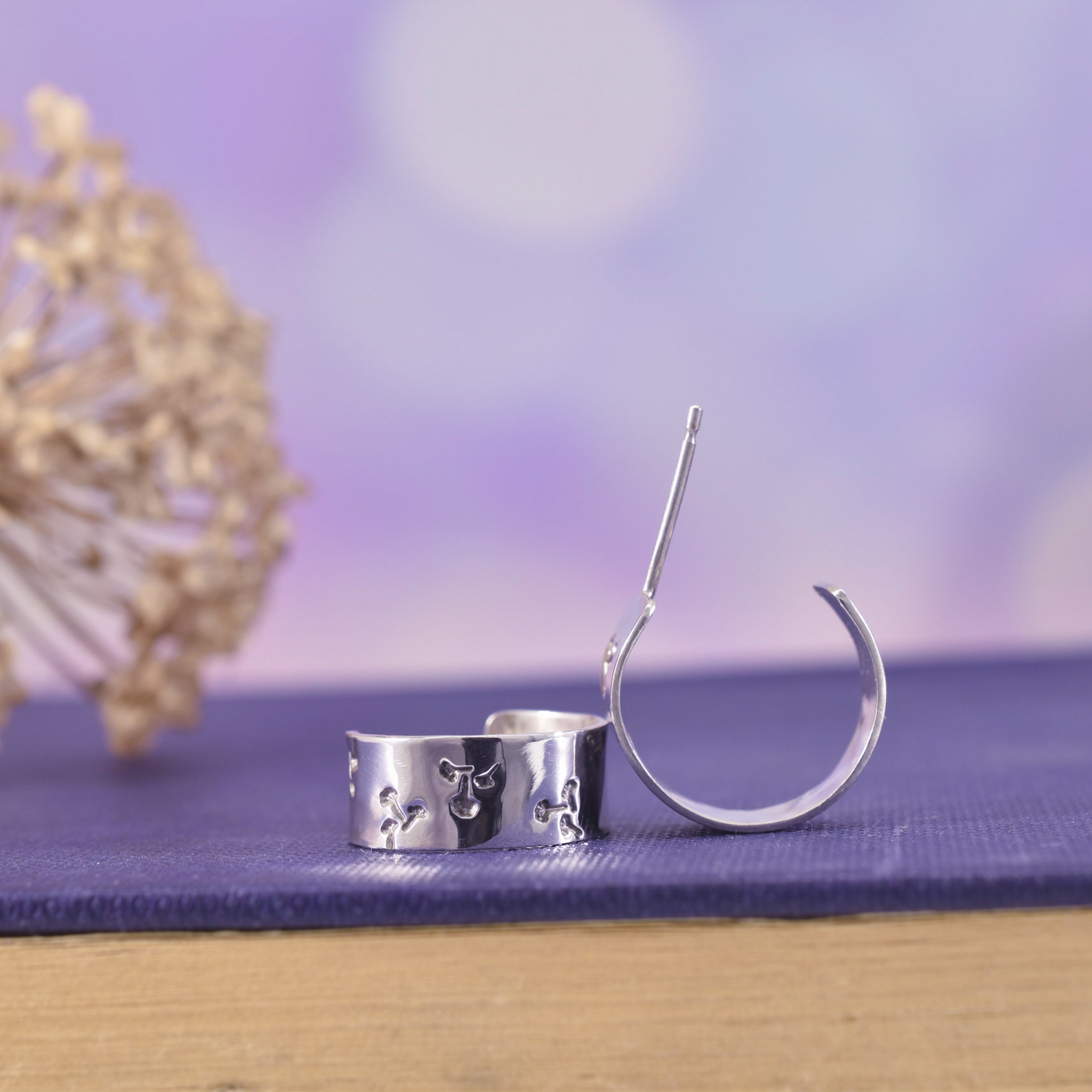 Silver huggie hoops earrings with wish texture