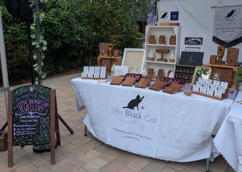 An Image of Little Black Cat Jewellery's stall at an outdoor event